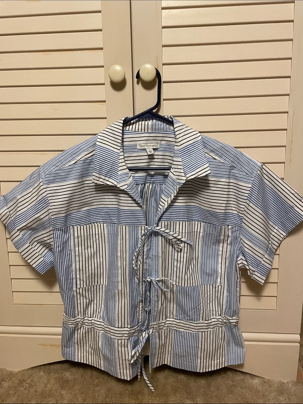 Free Assembly striped cotton shirt with tie closures in EUC and shirt pockets